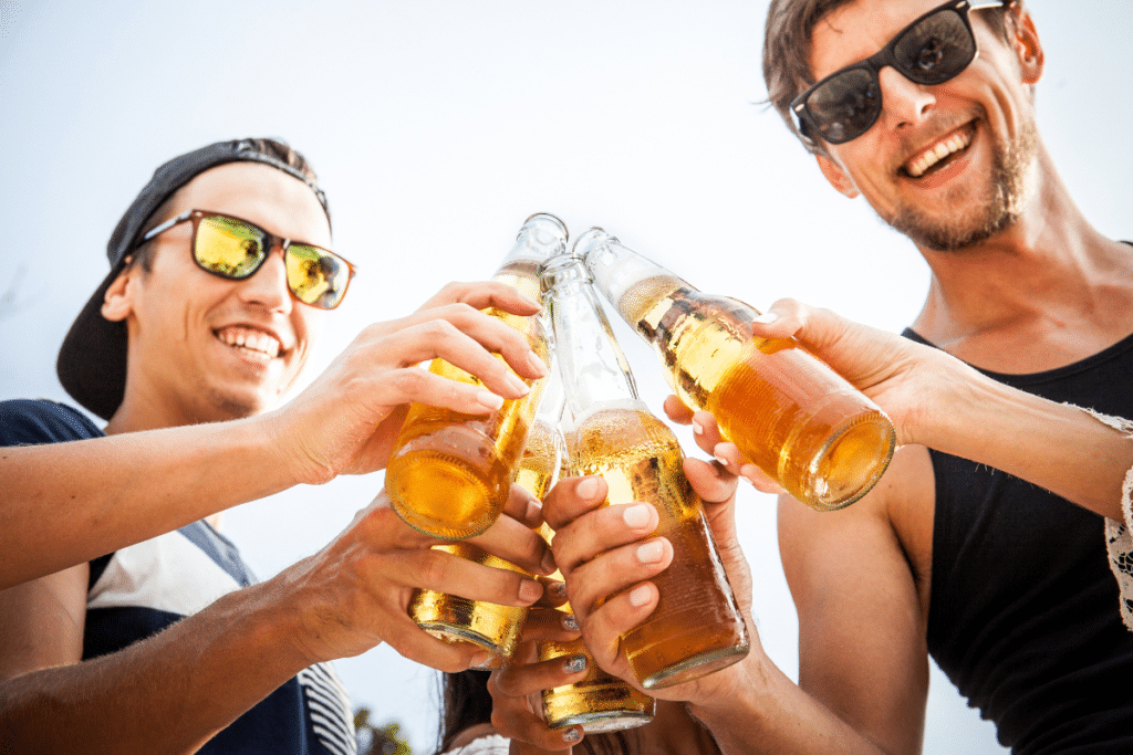 Friends enjoying beer outside.